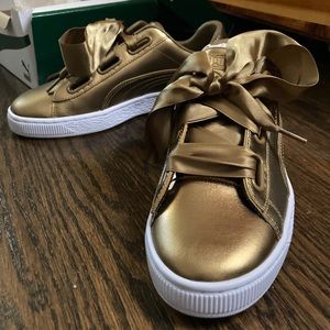 Gold puma sneakers